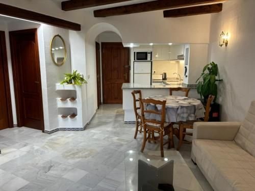 Dining area with the kitchen through the arch